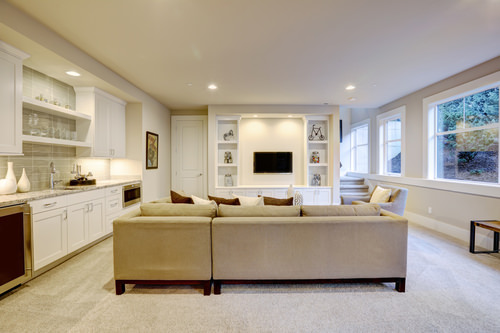 Chic basement living room with wet bar
